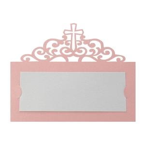 Detailed view of pink laser-cut cross table card with intricate floral patterns for weddings
