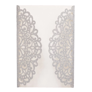 Intricate laser-cut silver glitter wedding invitation featuring a floral mandala design