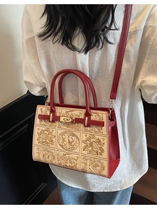 Elegant vintage trapezoid handbag in burgundy and beige with crest embroidery and metal lock