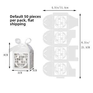 Flat pack view of 50 white laser-cut world map gift boxes with white silk ribbons