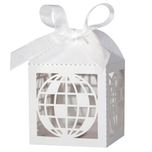 Detailed laser-cut hollow globe pattern on white paper candy box with ribbon bow