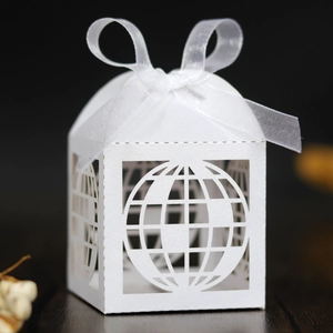 White laser-cut globe gift box with shimmering finish and white organza ribbon bow