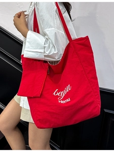 Red plaid tote bag with artistic beyou print and small side pouch for daily commute