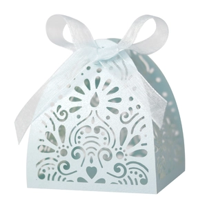 Detailed laser-cut floral pattern on light blue gift box with a white organza ribbon bow
