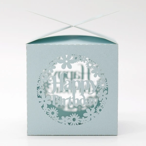 Detail of light blue laser-cut square gift box with 3D floral Happy Birthday pattern