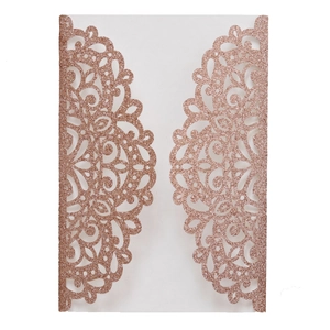 Detail of rose gold glitter laser-cut floral invitation cover with mandala design