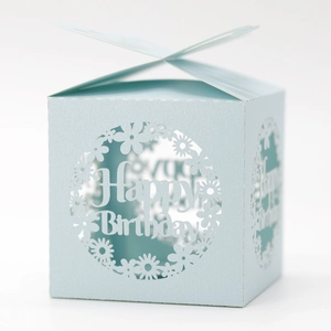 Macro view of blue butterfly laser-cut gift box featuring Happy Birthday carving