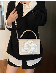 Creamy white crossbody bag with 3D floral accent and pearl chain strap for women