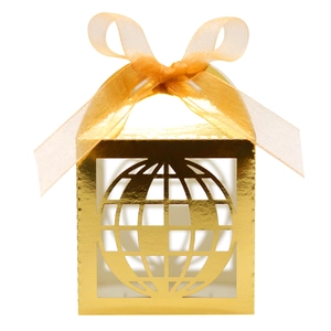 Detailed laser-cut gold globe gift box featuring a premium metallic finish and ribbon bow
