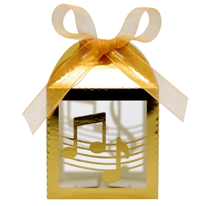 Detail showing musical note cutout on gold favor box with elegant satin ribbon bow