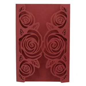 Detailed laser-cut rose pattern on premium burgundy pearlescent paper invitation cover