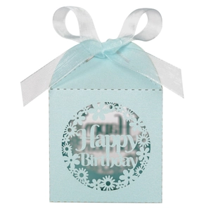 Detail of light blue laser-cut Happy Birthday favor box with white ribbon bow
