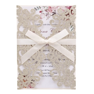 Champagne glitter laser-cut wedding invitation with cream bow and floral insert card
