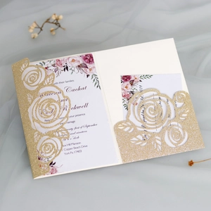 Detailed close-up of laser-cut gold glitter rose invitation with floral inner card