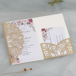 Detailed laser-cut glitter gold wedding invitation set with floral insert and RSVP card