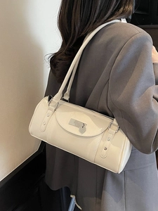 Chic cream-white bowling handbag with glossy finish and heart charm for women