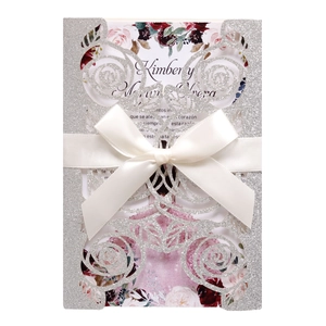 Laser cut glitter silver wedding invitation card with pink rose detail and ribbon bow