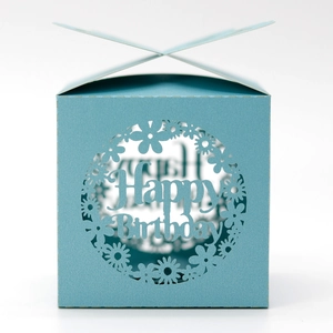 Close-up of laser-cut light blue candy box with Happy Birthday镂空 design