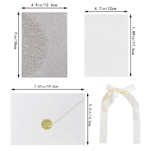 Macro detail of silver glitter laser cut invitation kit with dimensions for each component