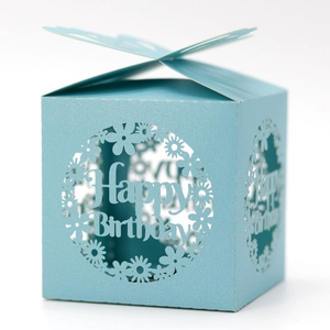 Detail of light blue pearl paper birthday candy box with laser cut hollow design