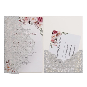 Detail of silver glitter laser-cut wedding invitation set with vintage red roses design