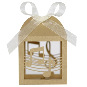 Detailed view of music-themed kraft favor box with musical notes and white organza ribbon