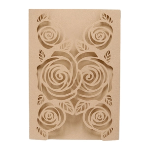 Detail showing intricate laser-cut rose patterns on elegant beige kraft paper envelope