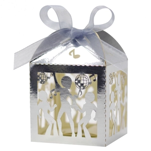 Macro detail of disco-themed mirror silver laser-cut gift box with ribbon