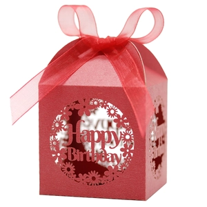 Detail of red laser-cut Happy Birthday candy box with silk ribbon bow decoration