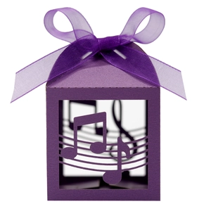 Detailed laser-cut purple favor box with musical note patterns and a matching ribbon