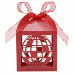 Detail of red laser-cut globe gift box featuring elegant sheer ribbon and matte finish