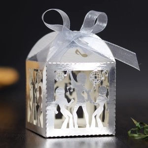 Detailed laser-cut silver party favor box featuring dance silhouettes and disco ball