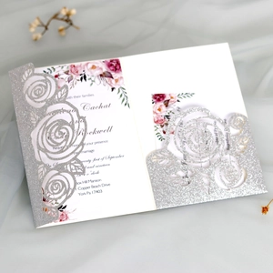 Detail of silver glitter laser cut rose invitation with pink floral insert card