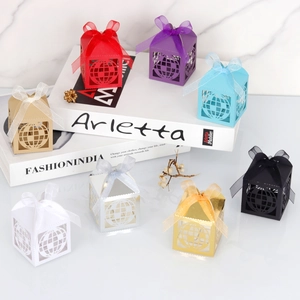 Detailed hollow globe candy boxes with elegant ribbon bows in diverse assorted colors