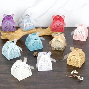Laser-cut floral gift boxes with elegant ribbon bows for wedding favors and parties