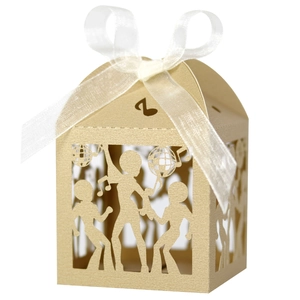 Detail of laser-cut gold disco party candy box with dancer silhouettes and music notes
