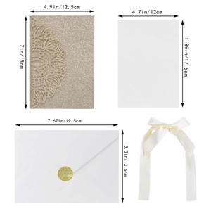 Detailed laser cut champagne gold glitter invitation set with envelope and satin ribbon