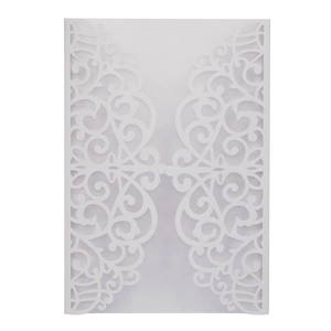 Detail of laser-cut wedding invitation cover with elegant vine patterns on pearl paper