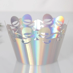 Close-up of holographic laser cupcake wrapper with delicate bow lace hollow design