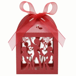 Detailed laser-cut party favor box featuring dance and music note motifs with red ribbon