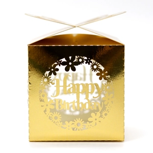 Detail of laser-cut Happy Birthday hollow butterfly design on golden gift box