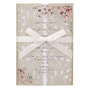 Elegant laser cut gold glitter wedding invitation set with white satin ribbon and floral insert