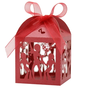 Detail of red laser-cut disco party candy box with dancer silhouettes and music notes
