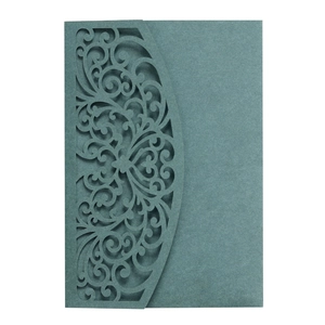Detailed laser-cut scrollwork on dark navy blue elegant wedding invitation card cover