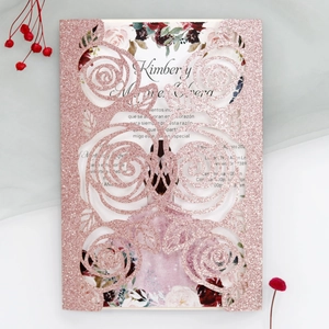 Detailed laser cut rose gold glitter wedding invitation with elegant floral hollow pattern
