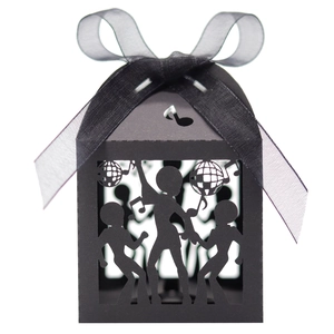 Detail view of black laser-cut disco party favor box with dancers and music notes