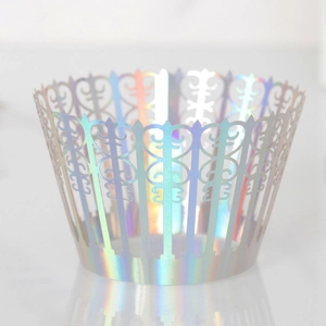 Close-up of laser-cut iridescent crown cake wrappers with metallic laser hollow pattern