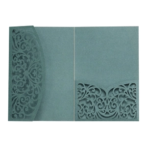 Detailed laser-cut scrollwork pattern on high-quality dark grey-blue wedding invitation cover