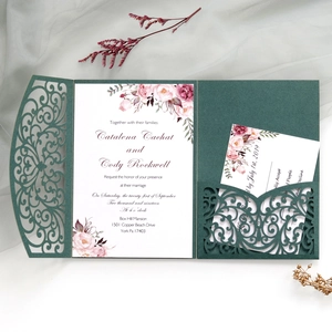Detail of dark green laser-cut floral wedding invitation set with printed inserts