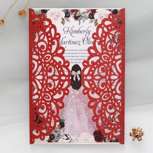 Detail of red glitter laser-cut invitation with floral girl design and elegant dried flowers